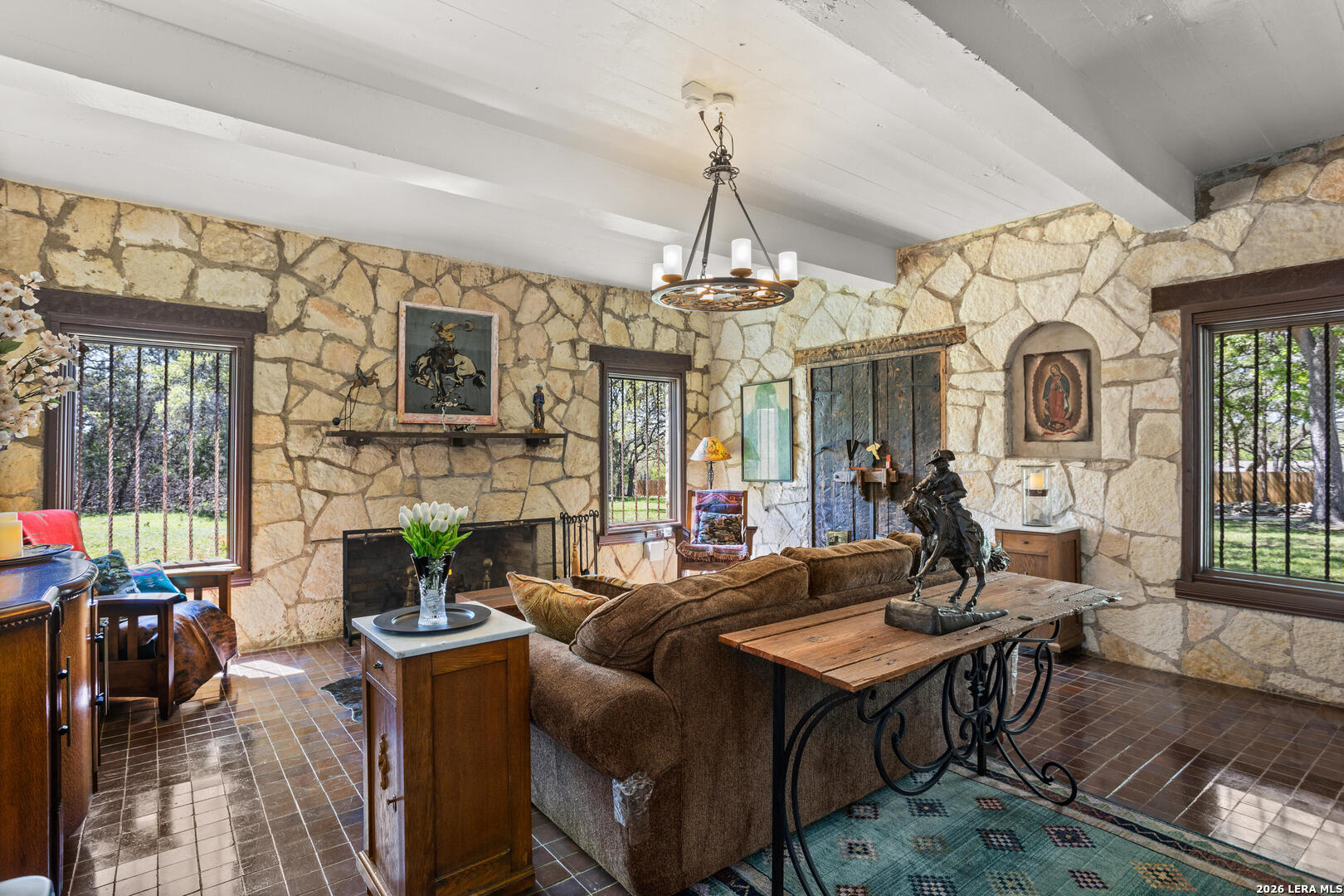 132 Ridge Place Boerne, TX 78006 - Photo 8 of 40 a living room with fireplace furniture and a chandelier