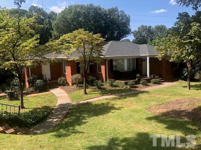 701 Dixie Trail Raleigh, NC 27607 - Photo 1 of 26 a view of a house with swimming pool and a yard with furniture