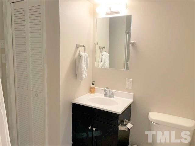 701 Dixie Trail Raleigh, NC 27607 - Photo 13 of 26 a bathroom with a sink vanity and toilet
