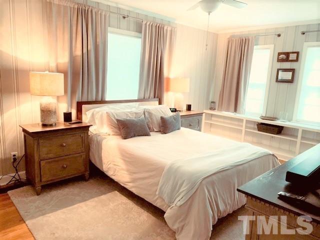 701 Dixie Trail Raleigh, NC 27607 - Photo 15 of 26 a bedroom with a bed and a window