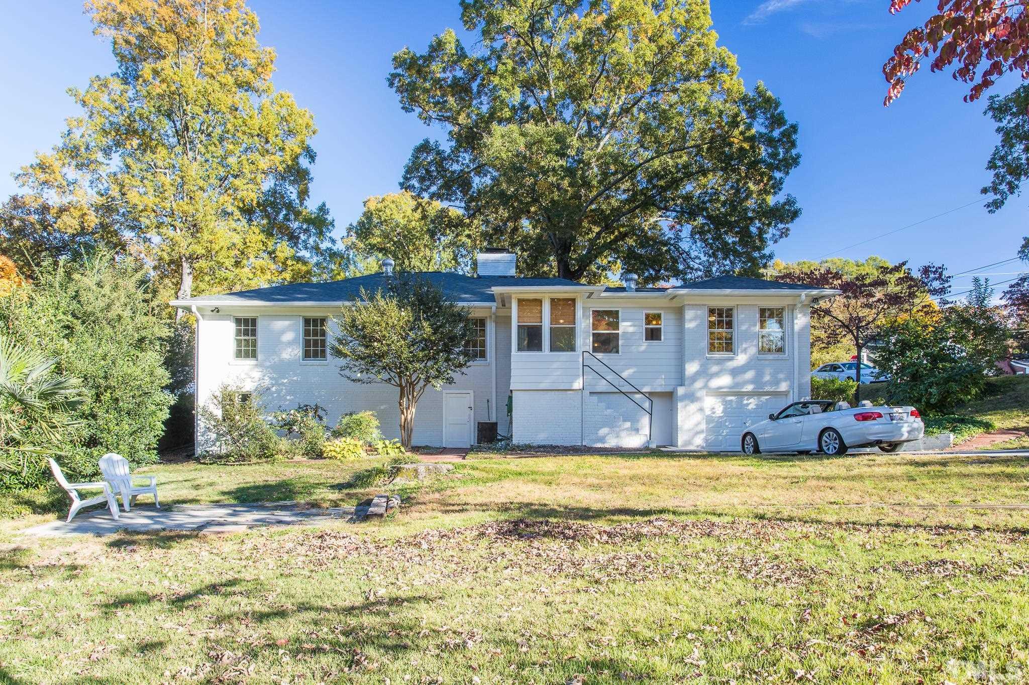 701 Dixie Trail Raleigh, NC 27607 - Photo 18 of 26 a view of house with outdoor space and swimming pool