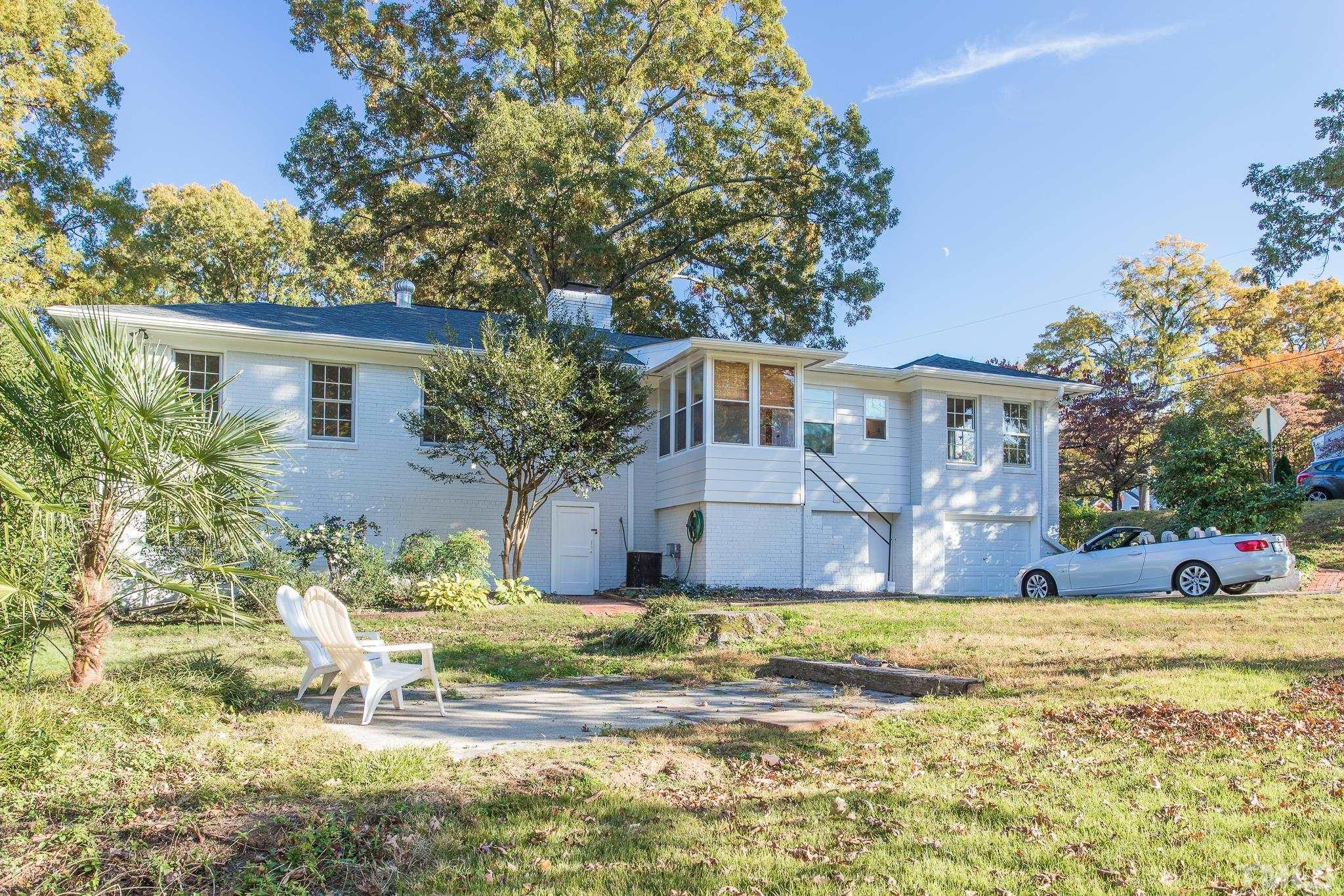 701 Dixie Trail Raleigh, NC 27607 - Photo 19 of 26 a view of house with outdoor space and swimming pool