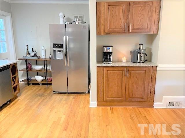 701 Dixie Trail Raleigh, NC 27607 - Photo 9 of 26 a kitchen with stainless steel appliances granite countertop a refrigerator a stove and a sink with cabinets