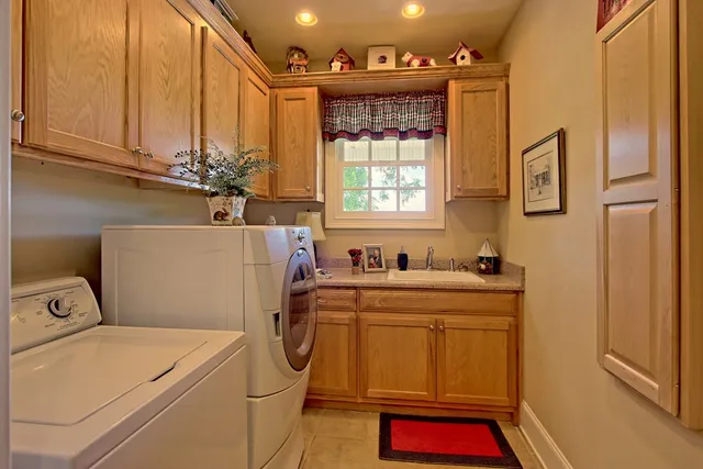 a kitchen with stainless steel appliances granite countertop a stove and a sink