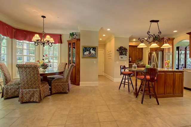 a living room with furniture a window and a fireplace