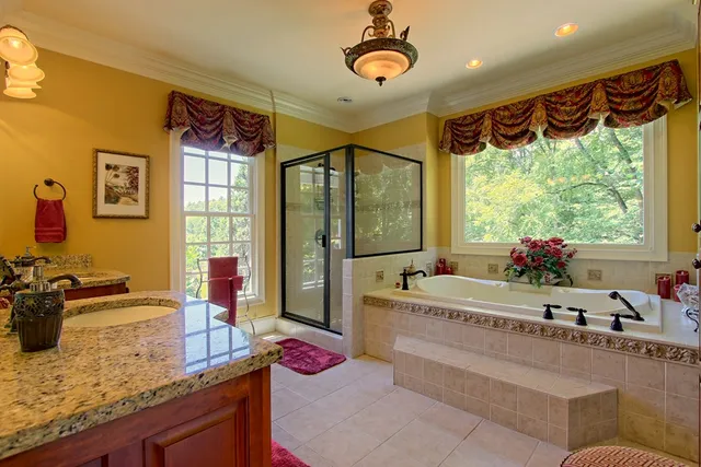 a bathroom with a bathtub and shower