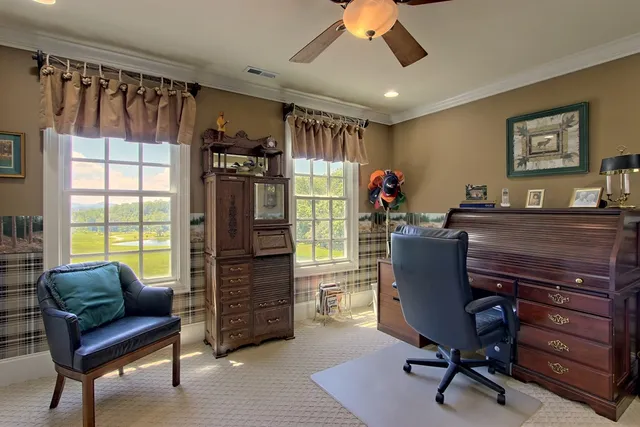 a spacious bathroom with a toilet sink and mirror