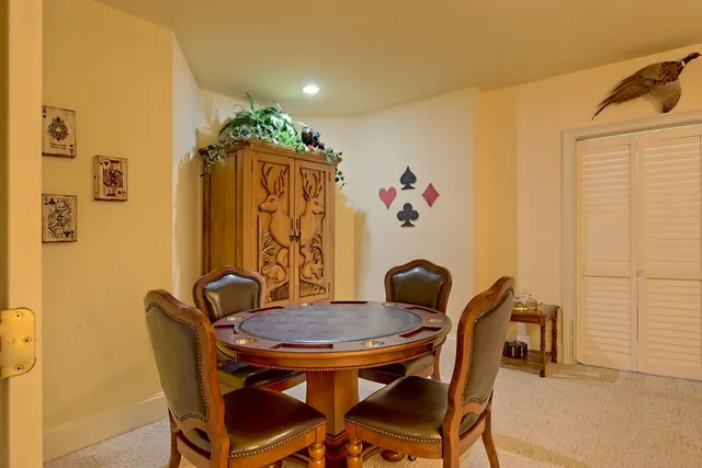 a view of a house with yard and sitting area