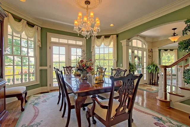 a kitchen with stainless steel appliances granite countertop a sink and a refrigerator