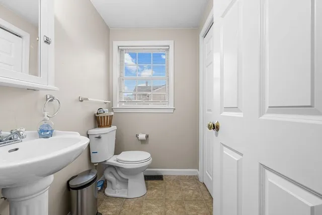 a bathroom with a sink toilet and vanity