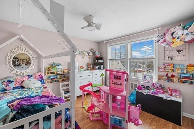 a bedroom with lots of furniture and a baby crib