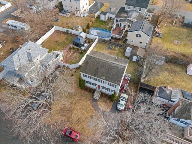 an aerial view of a yard with table and chairs