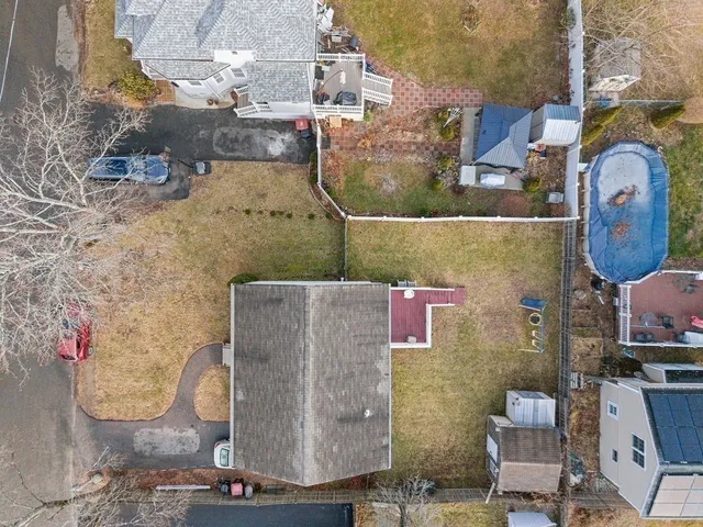 an aerial view of a house with outdoor space