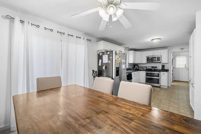 a view of kitchen with cabinets and stainless steel appliances
