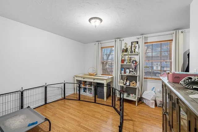 a bedroom with furniture and a window