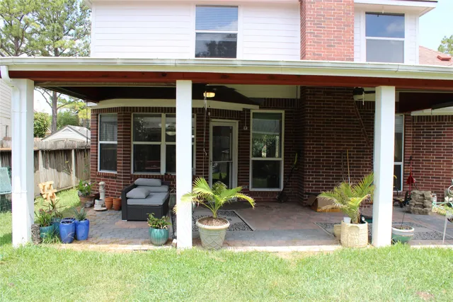 a front view of a house with outdoor seating