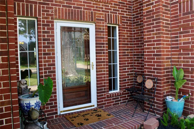 a view of a door and a window