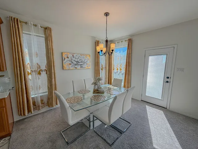 a dining room with furniture and window