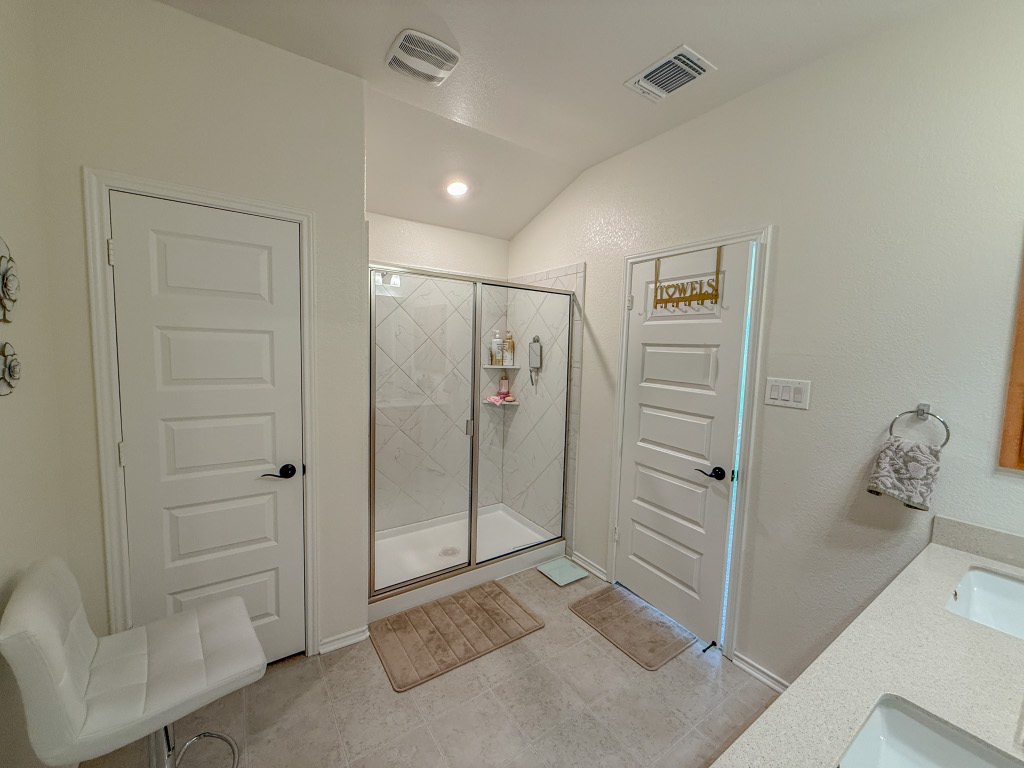 121 Outlaw Drive Jarrell, TX 76537 - Photo 23 of 32 a bathroom with a shower and a sink