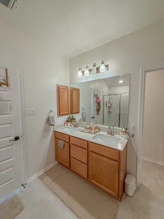 a bathroom with a shower and a sink