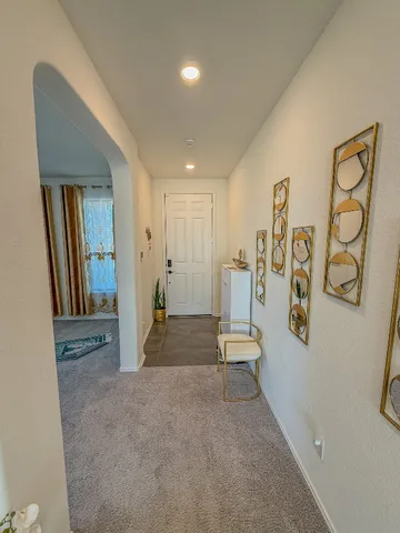 a view of a livingroom with stairs and a furniture