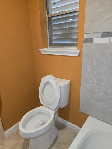 a bathroom with a toilet and a sink