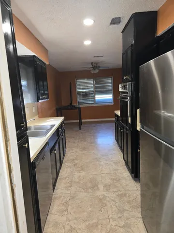 a view of hallway with washer and dryer