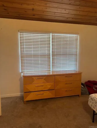 a view of a bed chair and a window