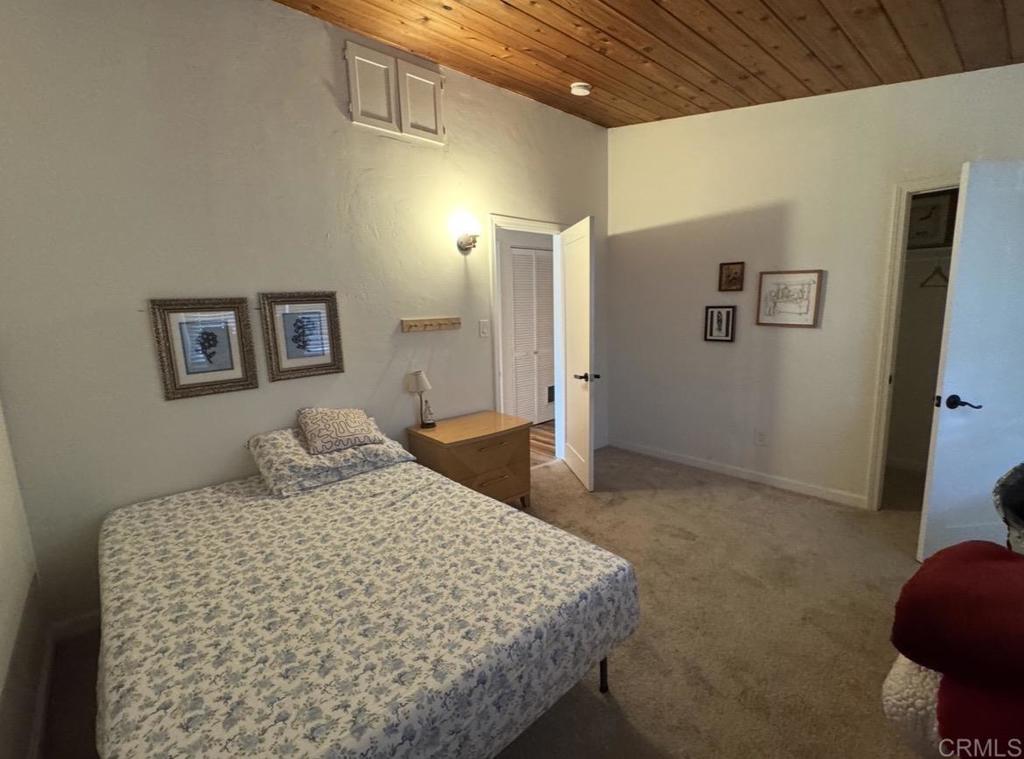 2610 Glebe Road Lemon Grove, CA 91945 - Photo 8 of 8 a bedroom with a bed and a cabinets