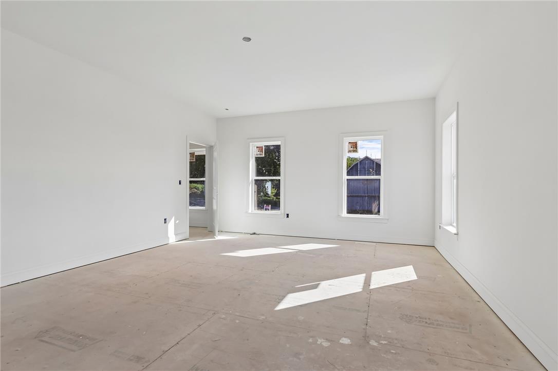 3237 Michaels School Road, Unit 9 Nazareth, PA 18064 - Photo 26 of 56 Natural light streams through multiple windows into this spacious room awaiting final flooring installation.