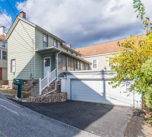 a front view of a house with a garage
