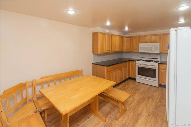 a kitchen with stainless steel appliances granite countertop a stove and a sink