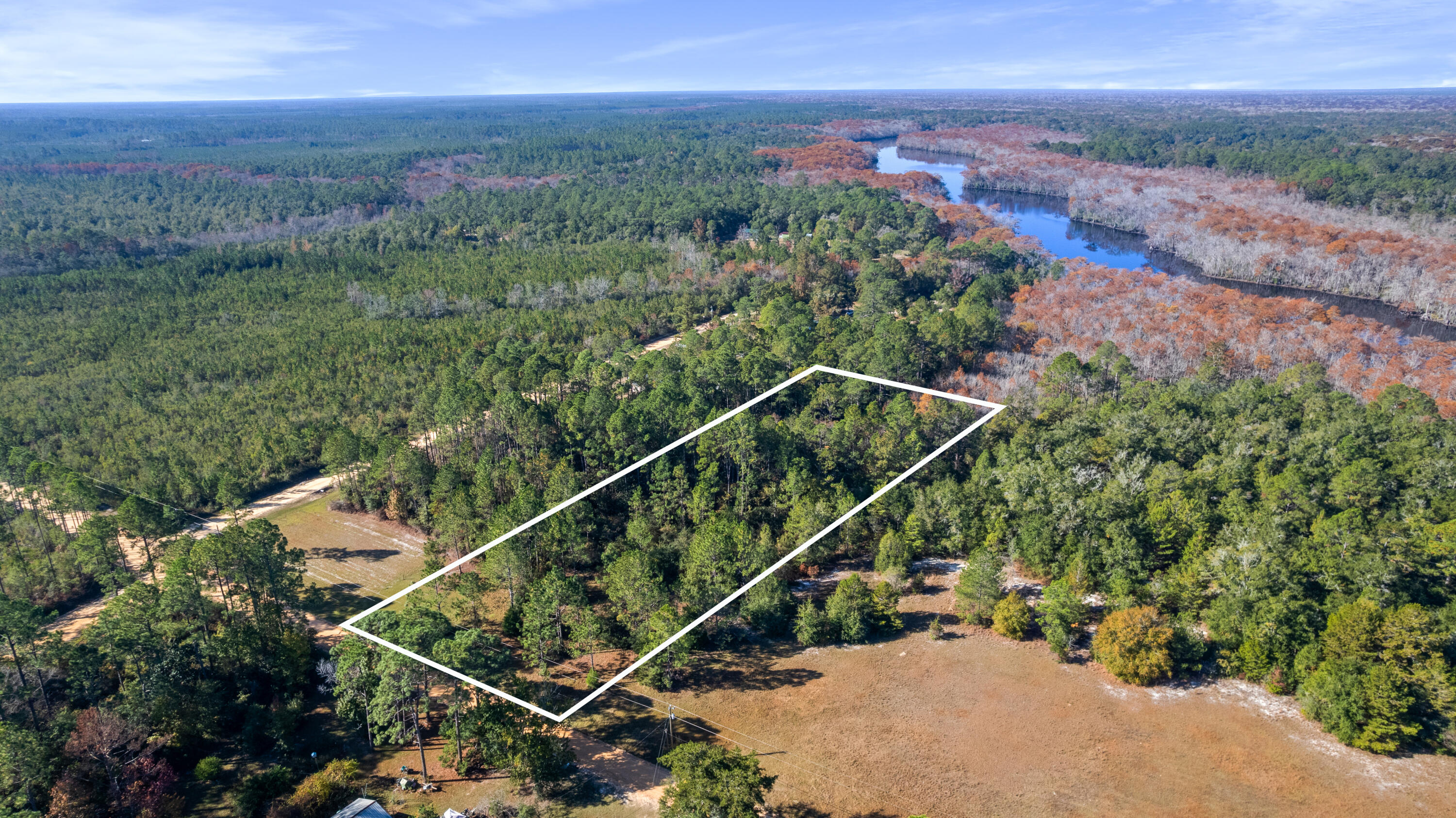 Lot B Anderson Road Ebro, FL 32437 - Photo 4 of 8 an aerial view of a house with a yard