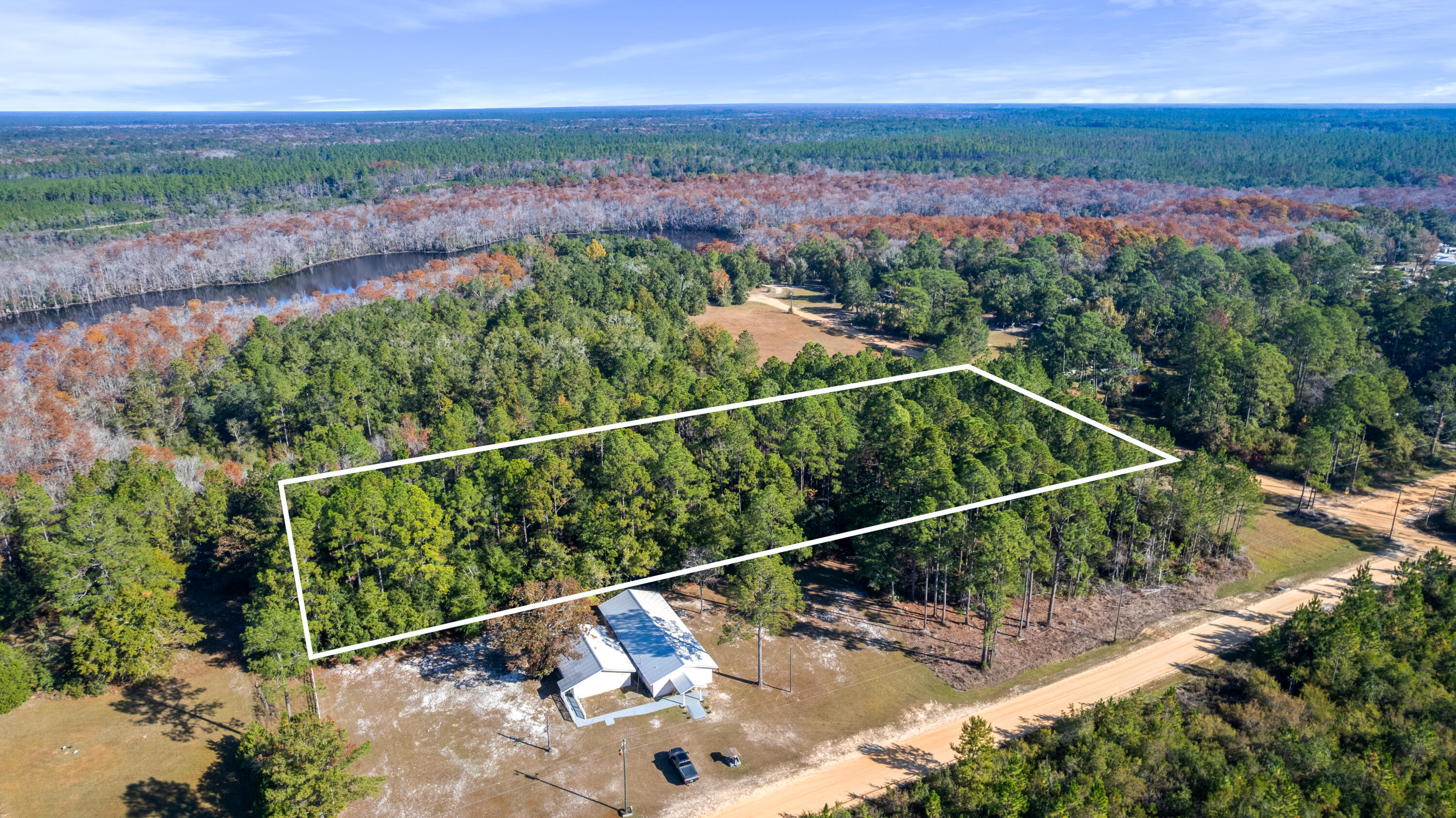 Lot B Anderson Road Ebro, FL 32437 - Photo 6 of 8 a view of a balcony with wooden floor and a forest