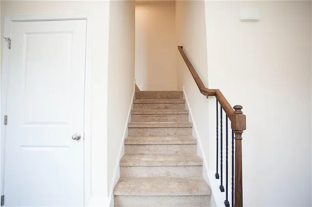 a view of a hallway with staircase