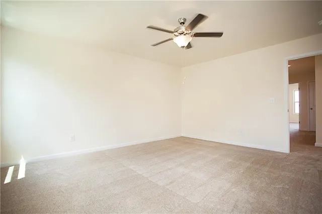 a white bath tub sitting in a bathroom next to a window