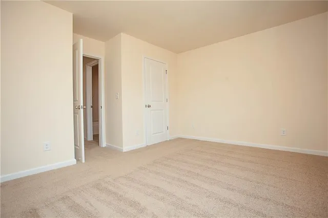 a white toilet sitting next to a bathroom sink