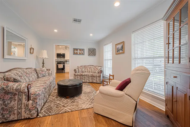 a bathroom with a granite countertop sink a toilet a mirror and shower