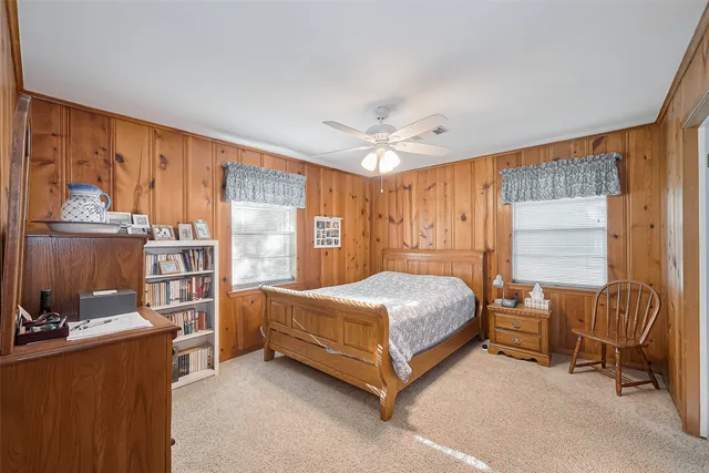 a swimming pool with trees in the background