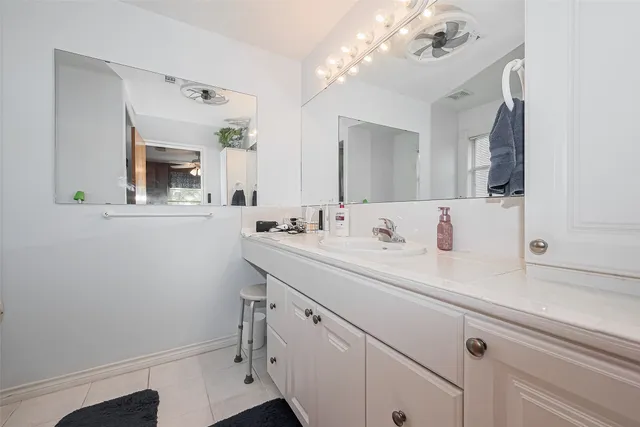 a view of a grassy field with trees