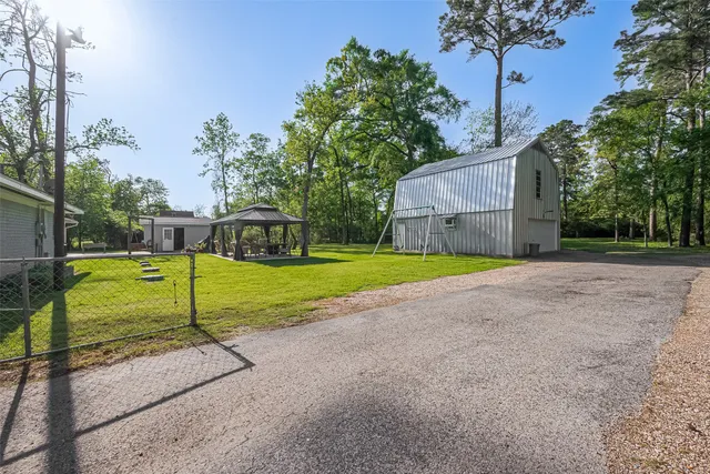 a view of a table and chairs under an umbrella