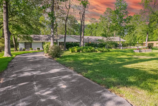 a view of a house with a big yard