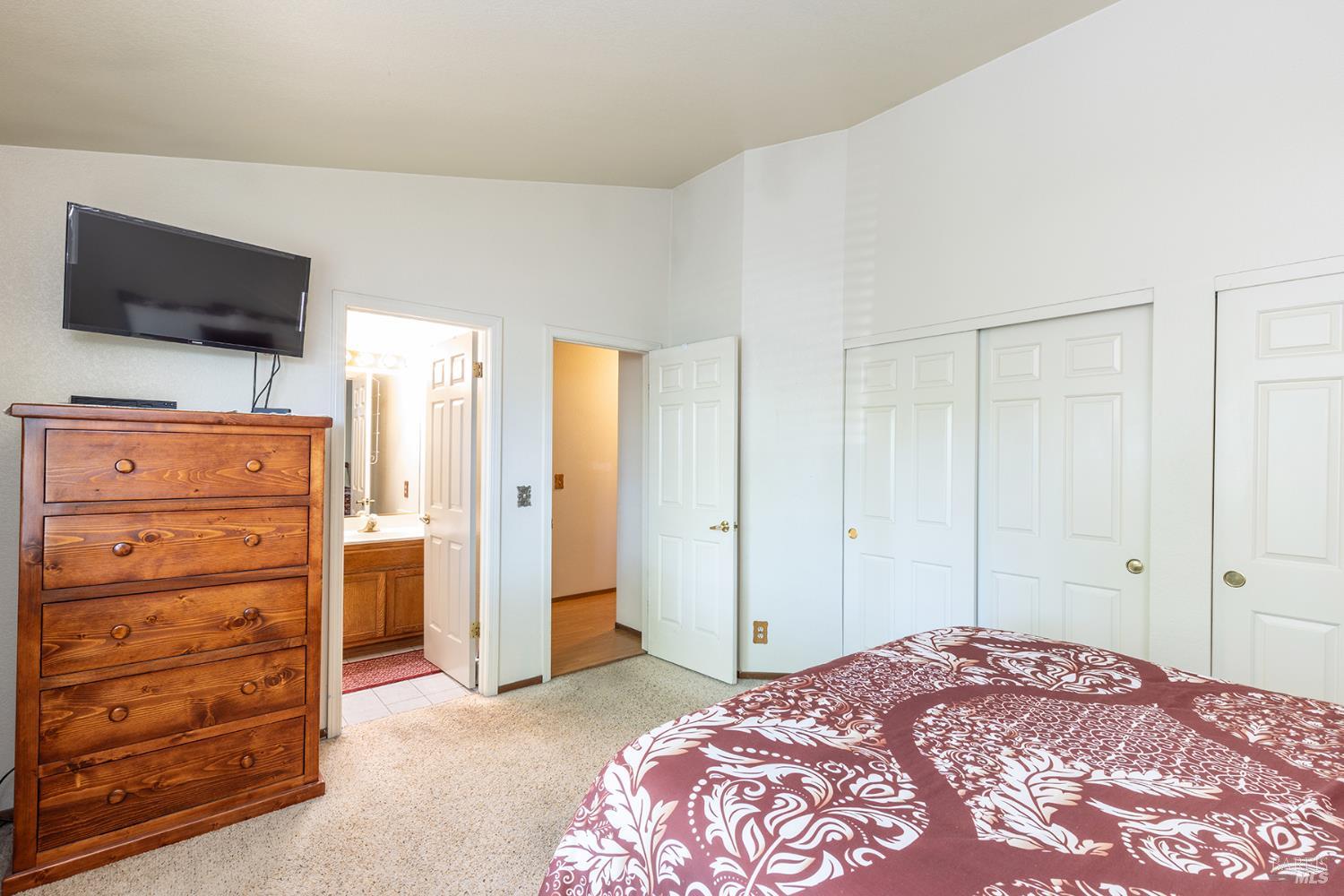1935 Seville Street Santa Rosa, CA 95403 - Photo 28 of 30 a bedroom with a bed and wooden floor