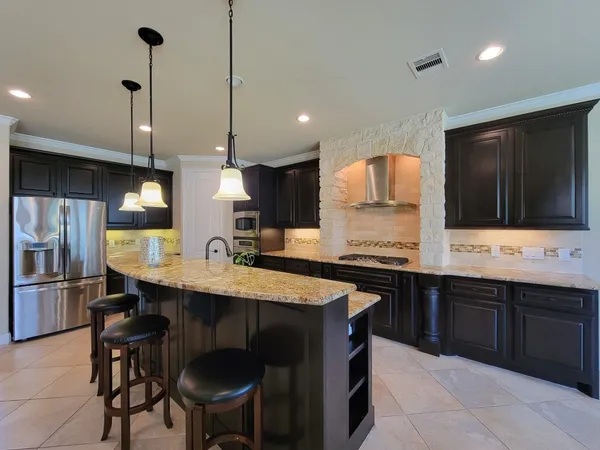 a kitchen with a sink cabinets and window