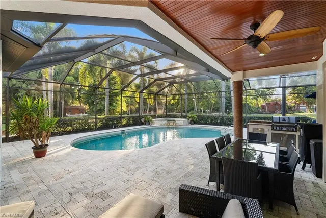 a view of a swimming pool with a patio