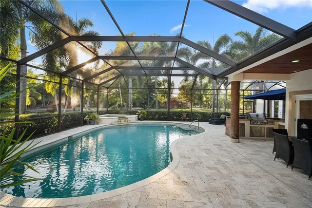 a view of a swimming pool with a patio