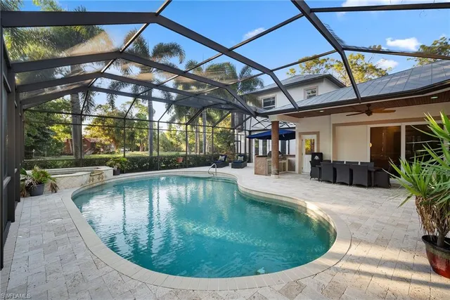a view of a swimming pool with a patio