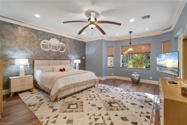 a living room with furniture a chandelier and a table