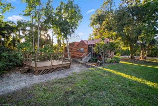 a front view of a building with a garden