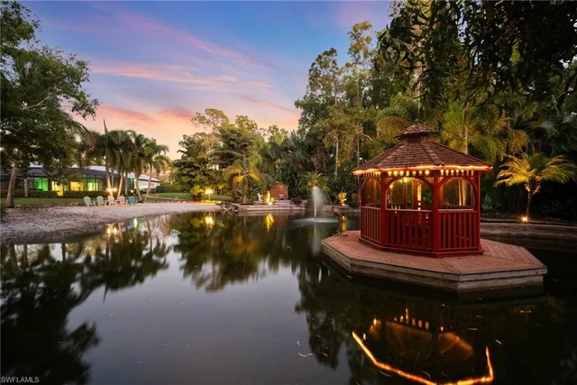 a view of park with large trees